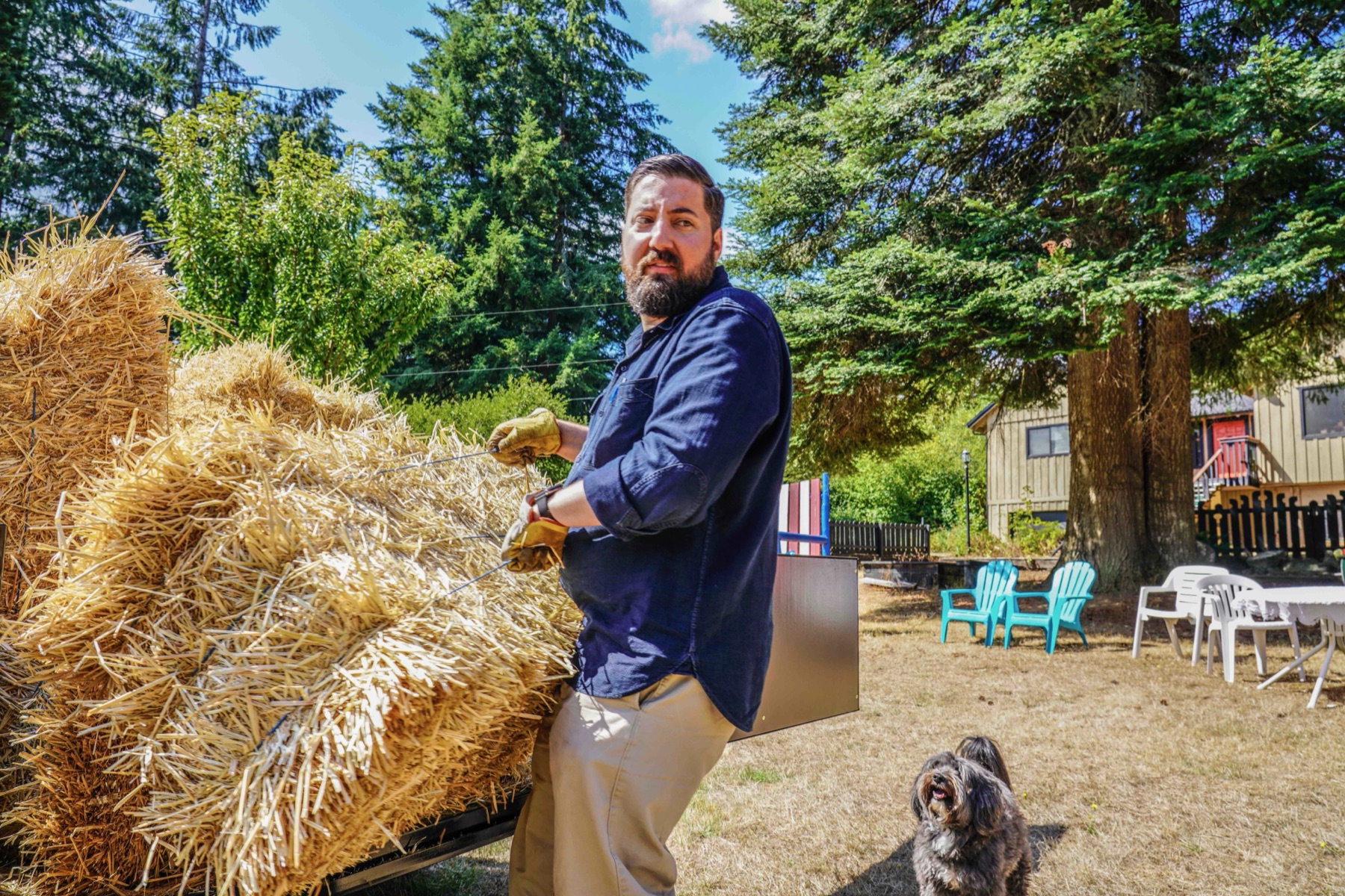 Andrew stacking hay at Daybreak Farm