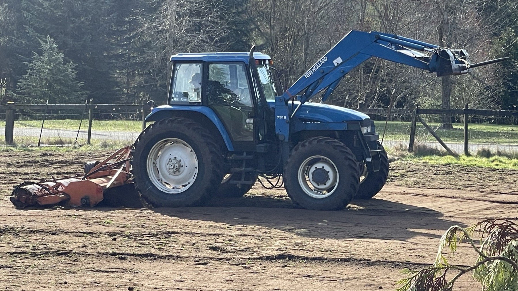 Freshly prepared hay field and garden area
