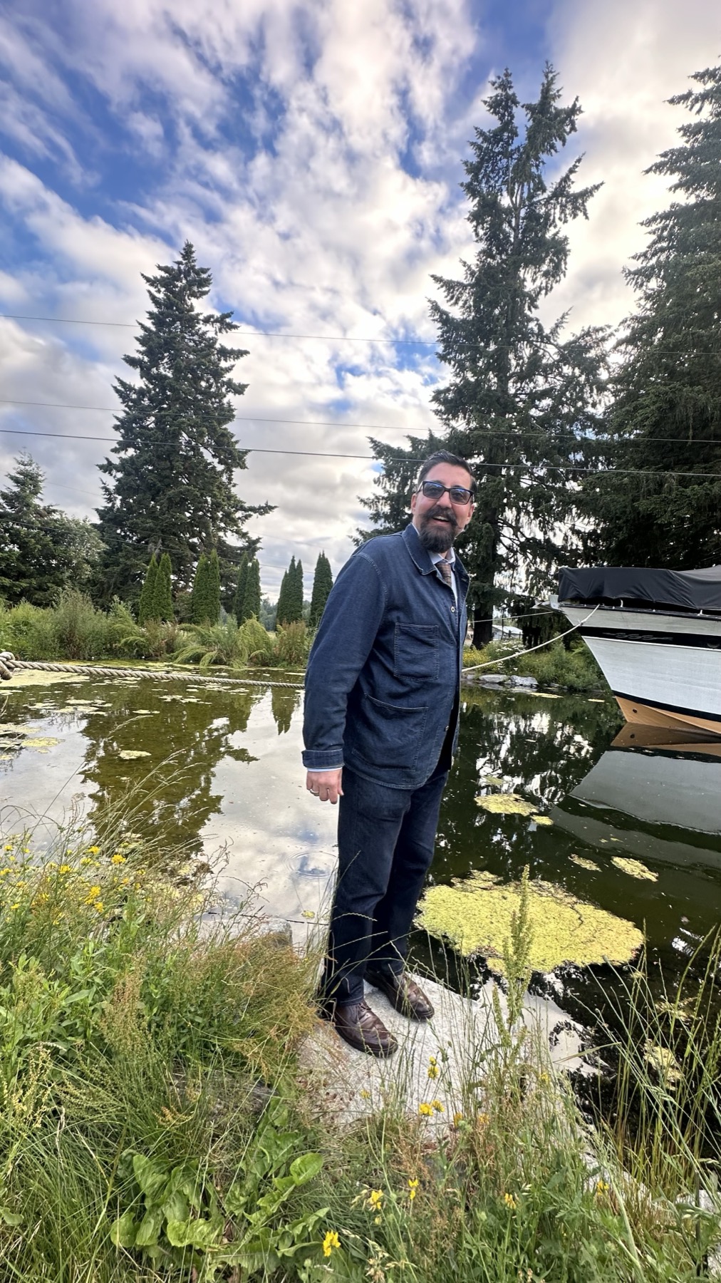 Pond with boat and landscaping